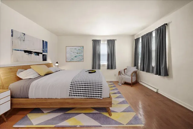 a view of hallway with wooden floor