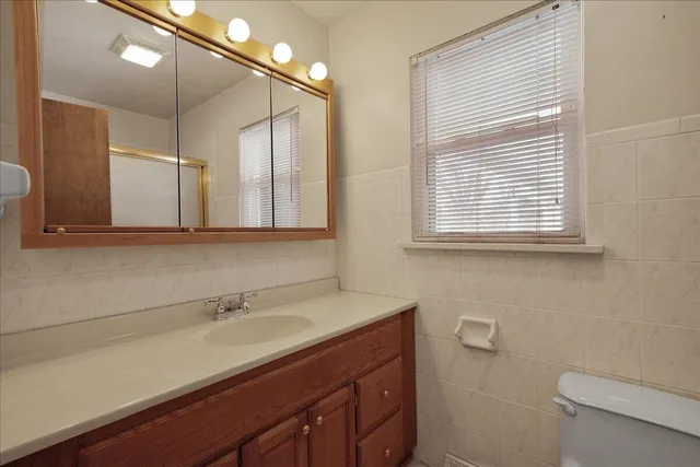 a view of a porch with wooden floor and fence