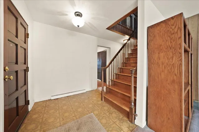 a view of a livingroom with furniture and a table