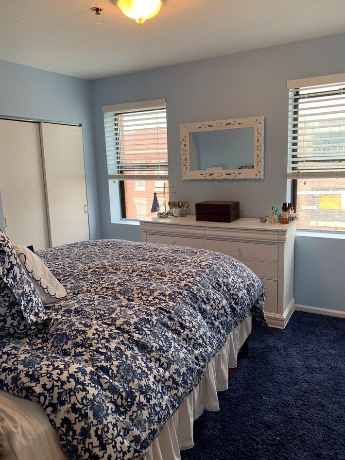 409 Adams Street, Unit 8 Hoboken, NJ 07030 - Photo 13 of 17 a bedroom with bed and window
