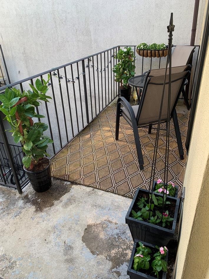 409 Adams Street, Unit 8 Hoboken, NJ 07030 - Photo 2 of 17 a view of a chairs and table in the backyard