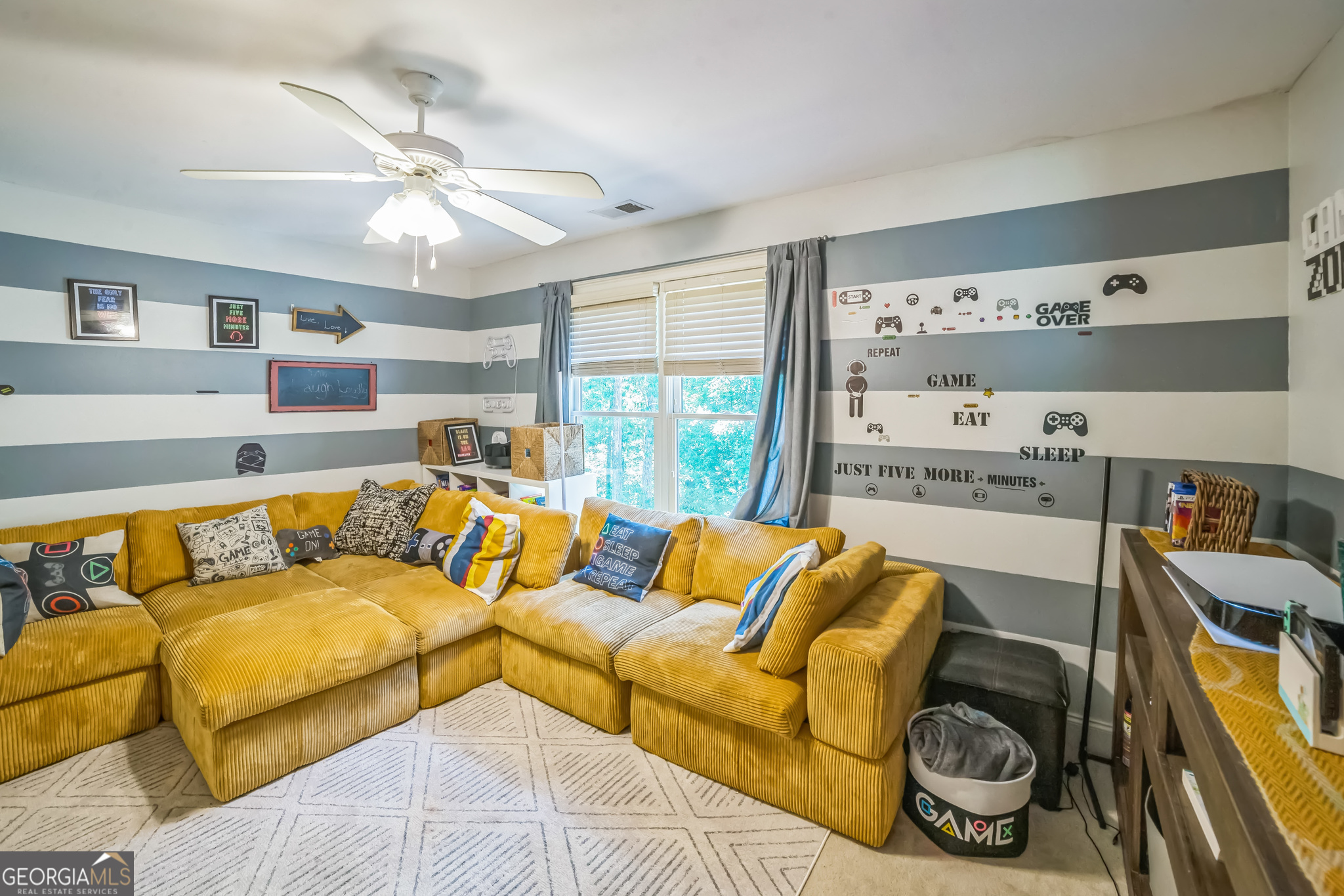 8260 Equinox Lane Fairburn, GA 30213 - Photo 16 of 39 a living room with furniture and a large window