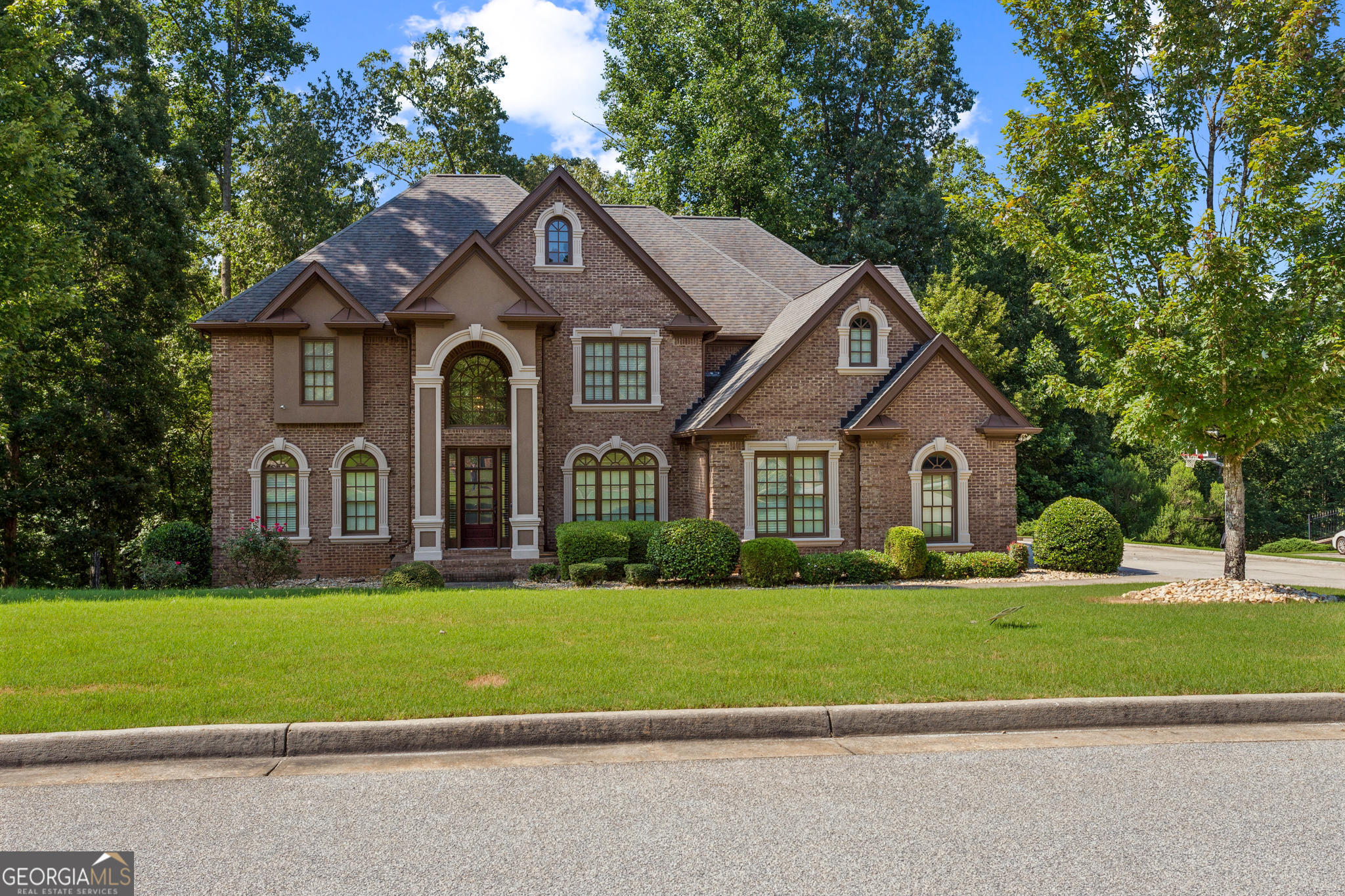 8260 Equinox Lane Fairburn, GA 30213 - Photo 2 of 39 a front view of a house with a yard