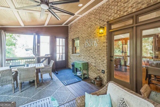 a view of a dining room with furniture wooden floor and a chandelier