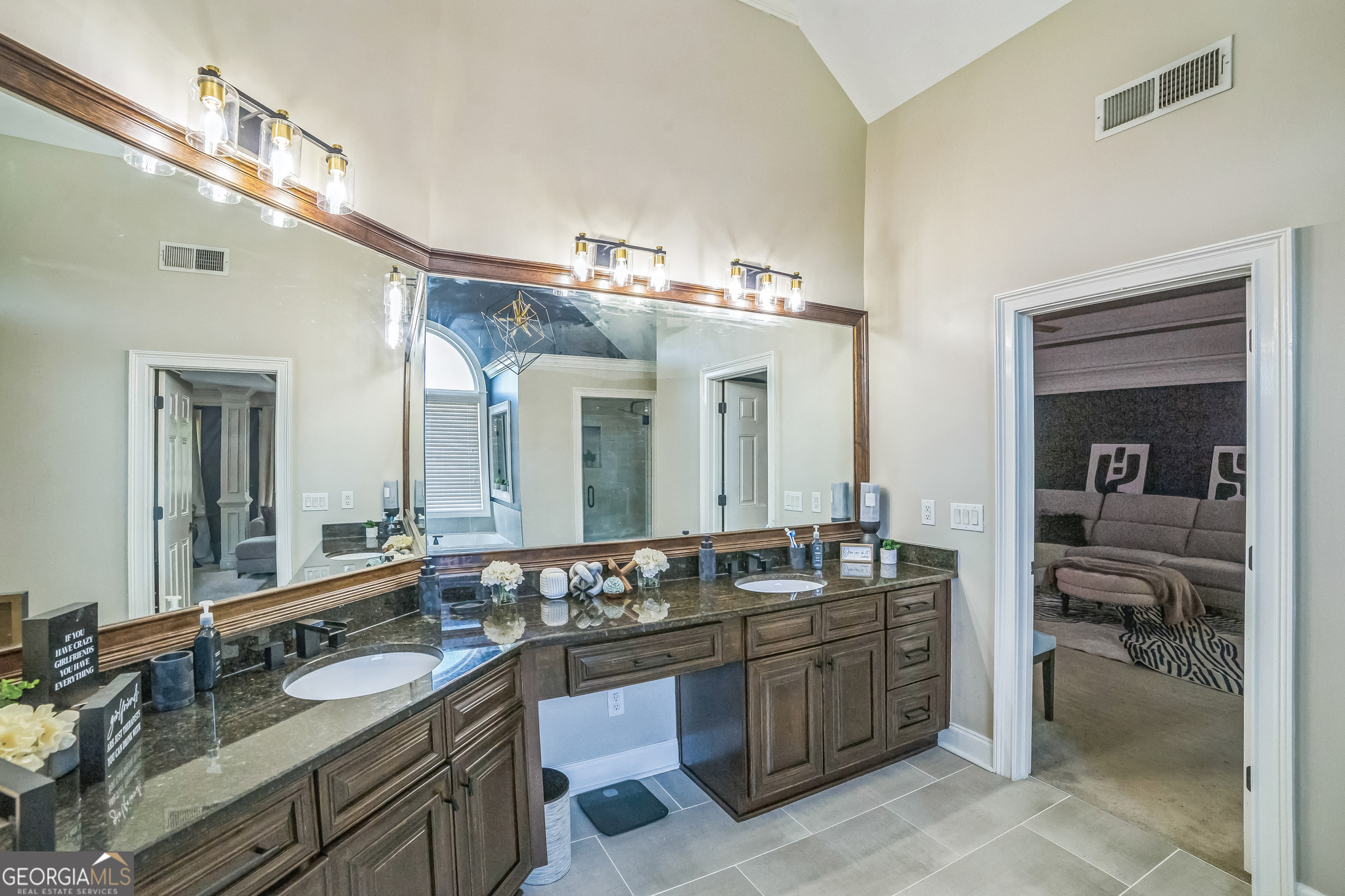 8260 Equinox Lane Fairburn, GA 30213 - Photo 27 of 39 a bathroom with a granite countertop double vanity sink and a mirror