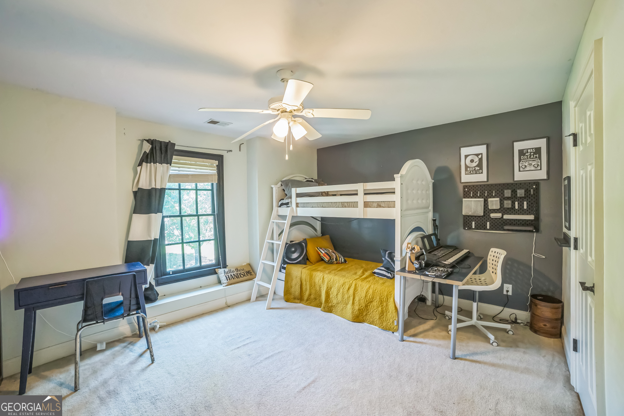 8260 Equinox Lane Fairburn, GA 30213 - Photo 33 of 39 a bedroom with furniture and a window