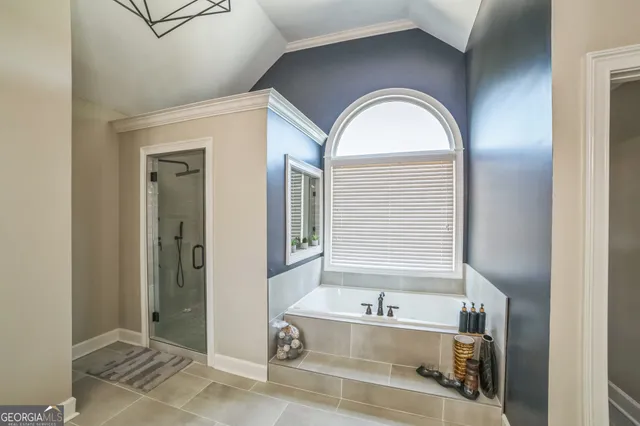 a bathroom with a granite countertop sink mirror and shower