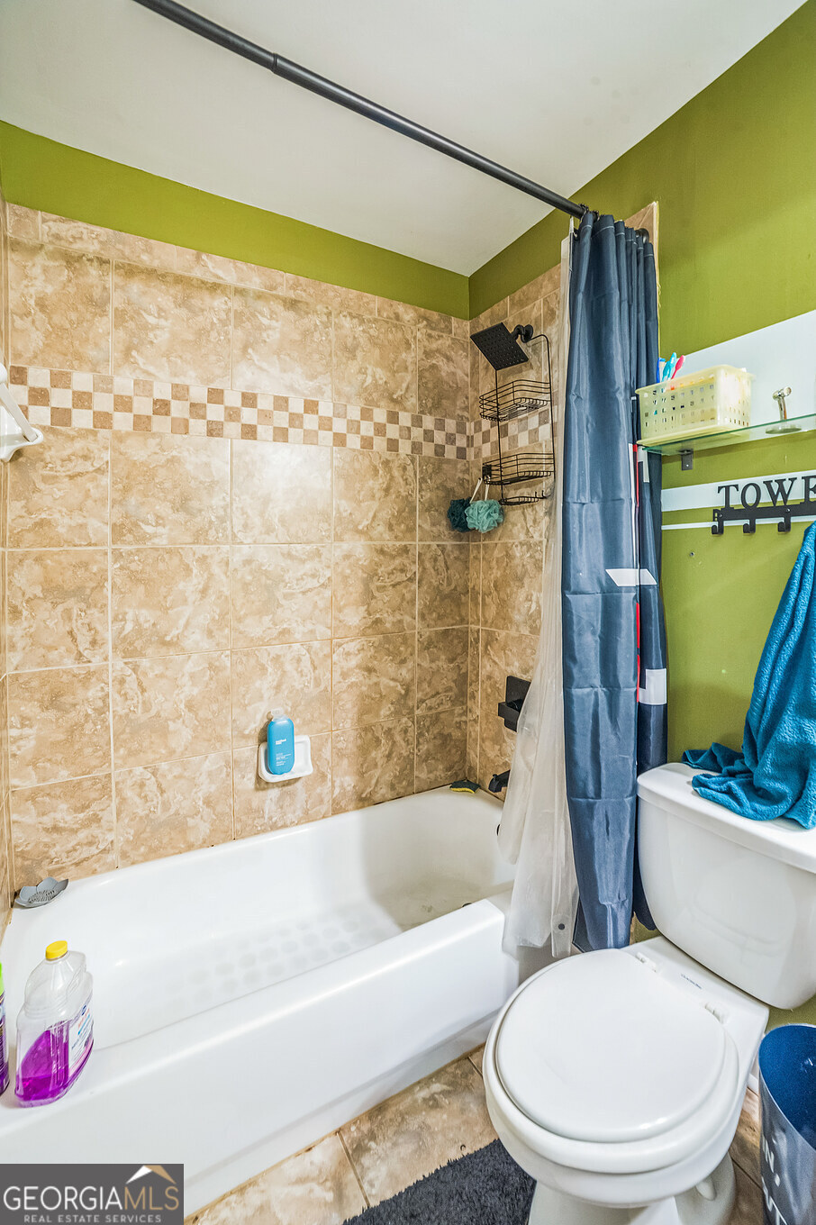 8260 Equinox Lane Fairburn, GA 30213 - Photo 35 of 39 a bathroom with a toilet and a bathtub