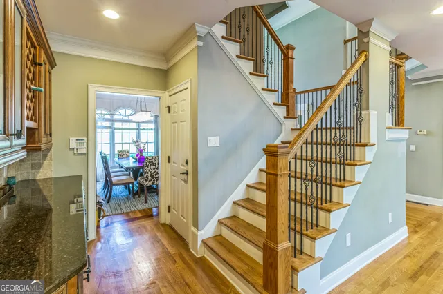a view of entryway and hall with wooden floor
