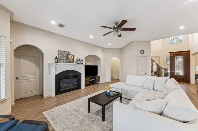 a living room with furniture and a fireplace