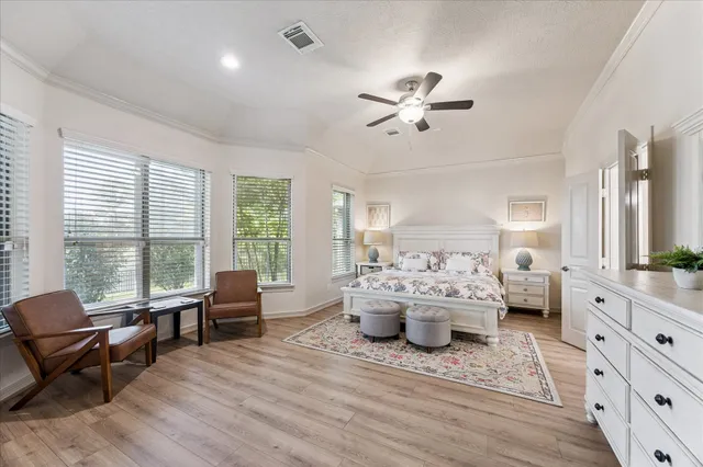 a living room with furniture large window and a chandelier