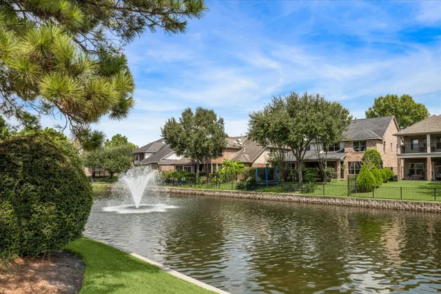 a view of a lake with a house in the background