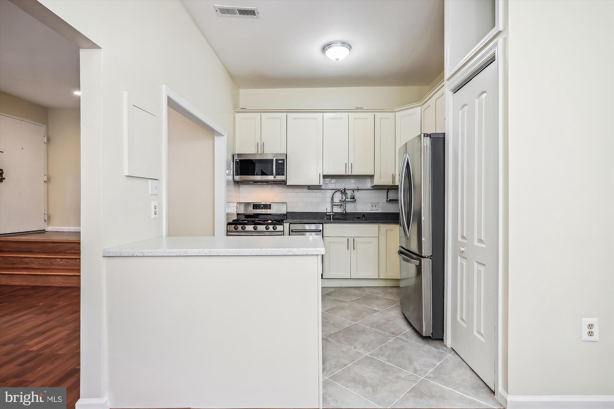 14432 Parkvale Road, Unit 6 Rockville, MD 20853 - Photo 8 of 44 Remodeled Kitchen with Tile Flooring