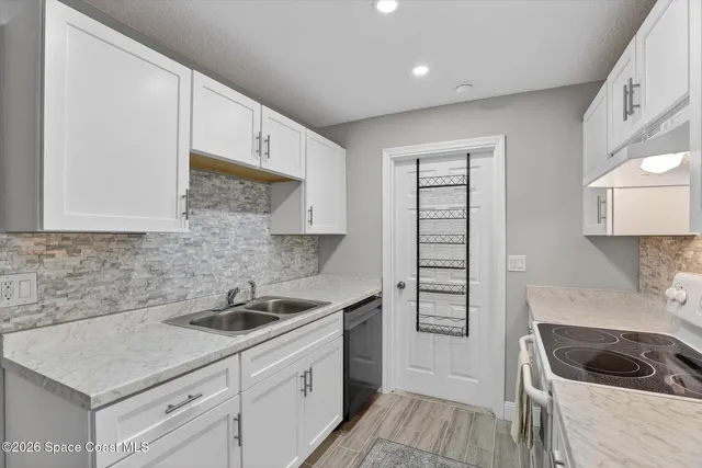 a dining room with a table and chairs