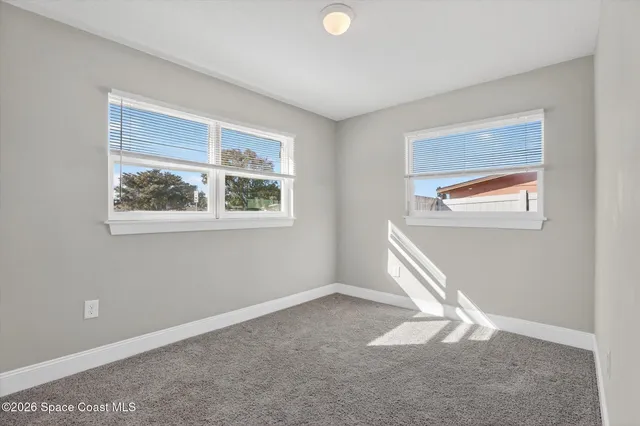 an empty room with windows