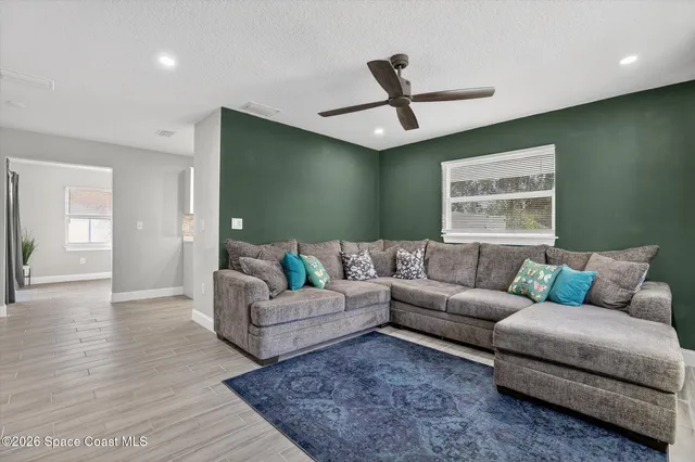 a living room with furniture and a window