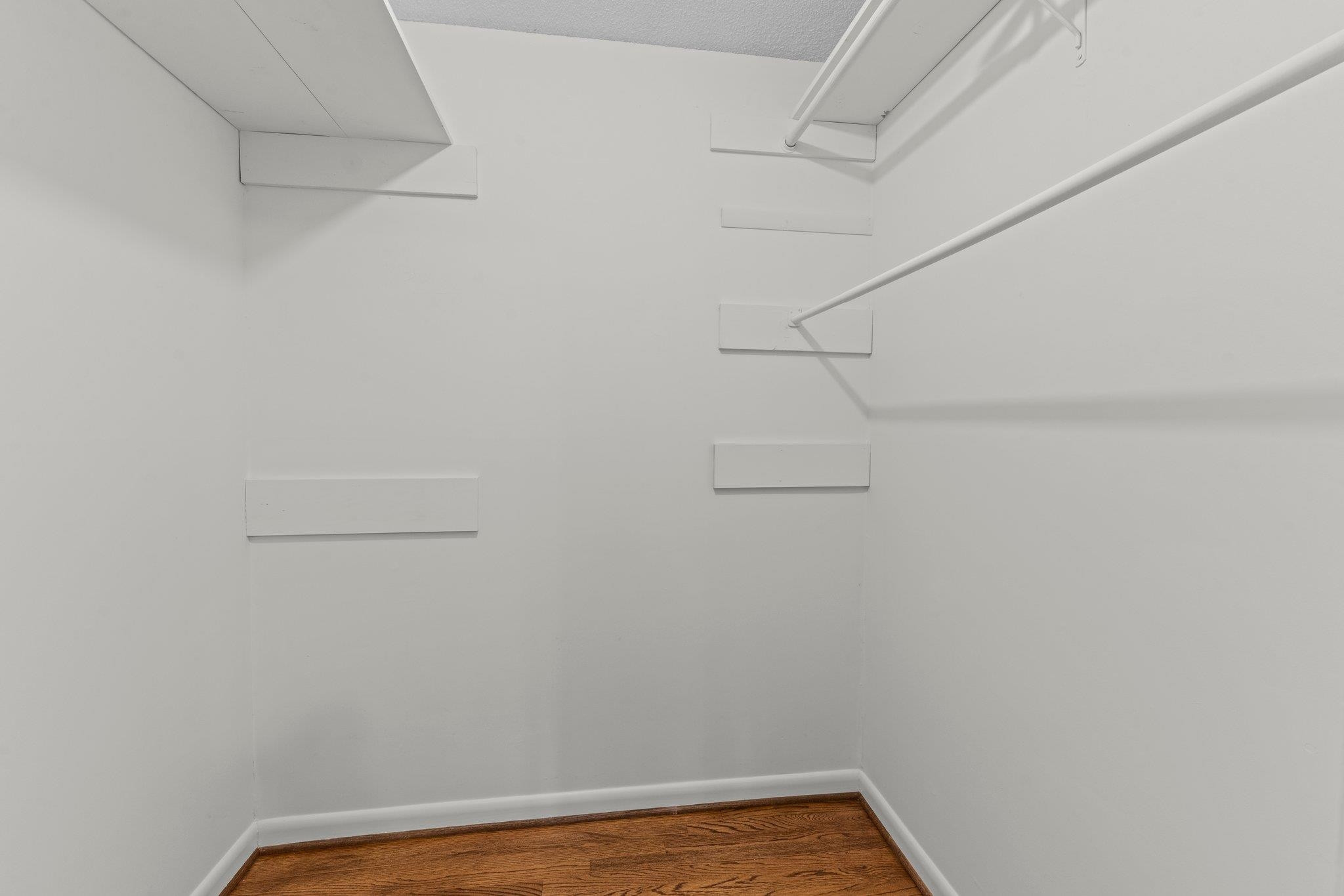 4505 Eliot Place Raleigh, NC 27609 - Photo 28 of 51 Primary Bedroom walk in closet with ample storage space. Primary Bedroom WIC