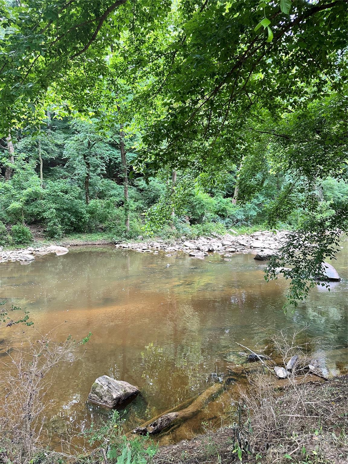 0 Tarlton Mill Road Marshville, NC 28103 - Photo 7 of 8 a view of a lake with an outdoor space