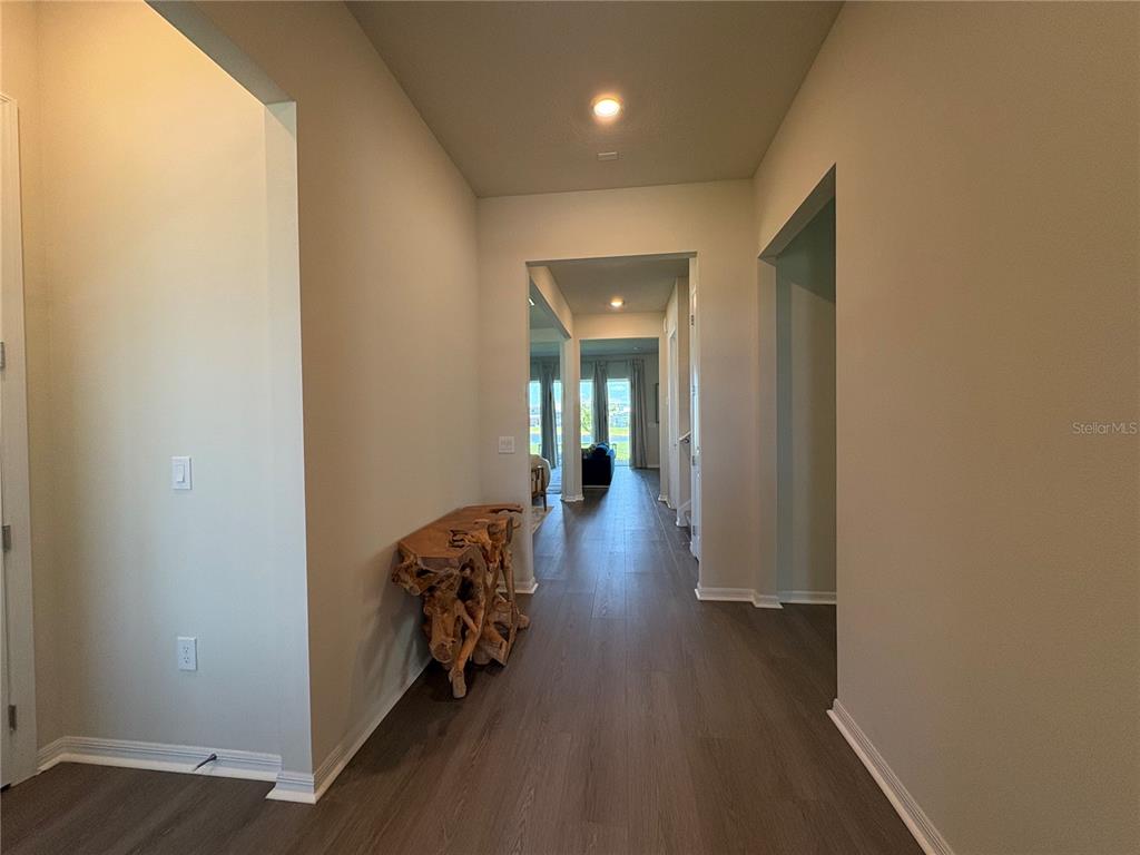 8243 Fenton Street Orlando, FL 32836 - Photo 11 of 35 a view of a hallway with wooden floor