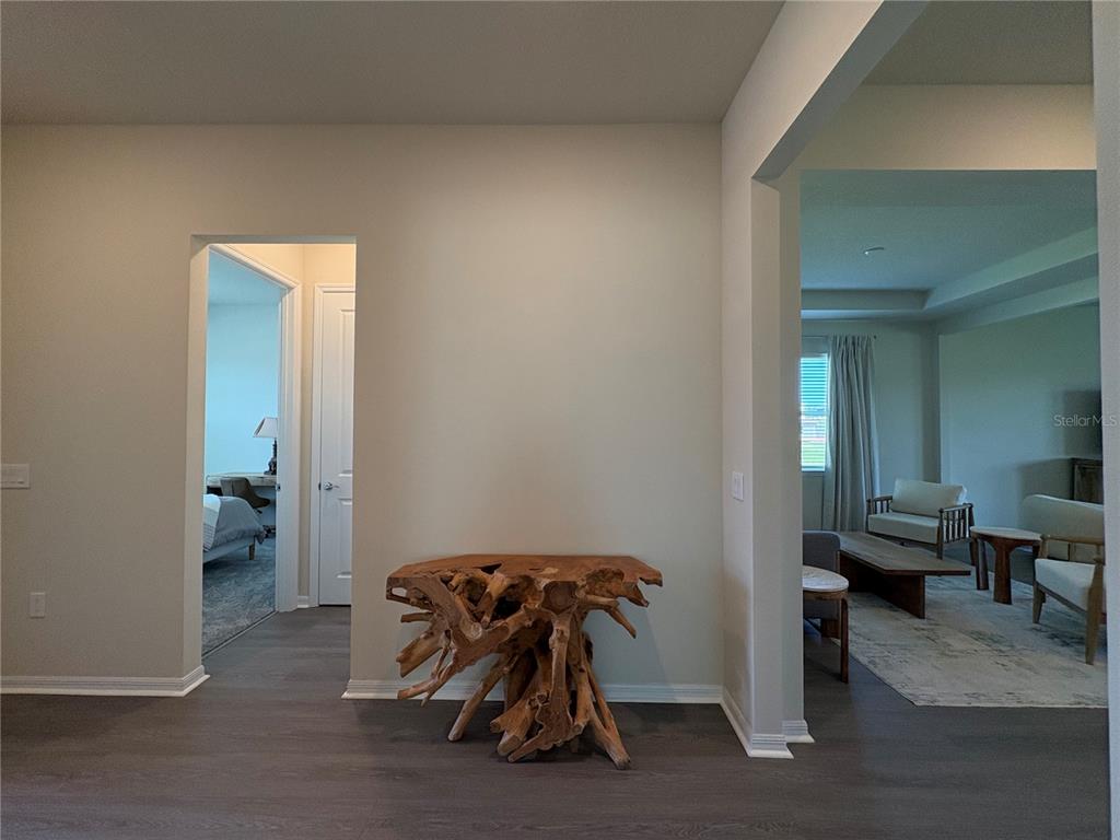 8243 Fenton Street Orlando, FL 32836 - Photo 12 of 35 a room with wooden floor and furniture