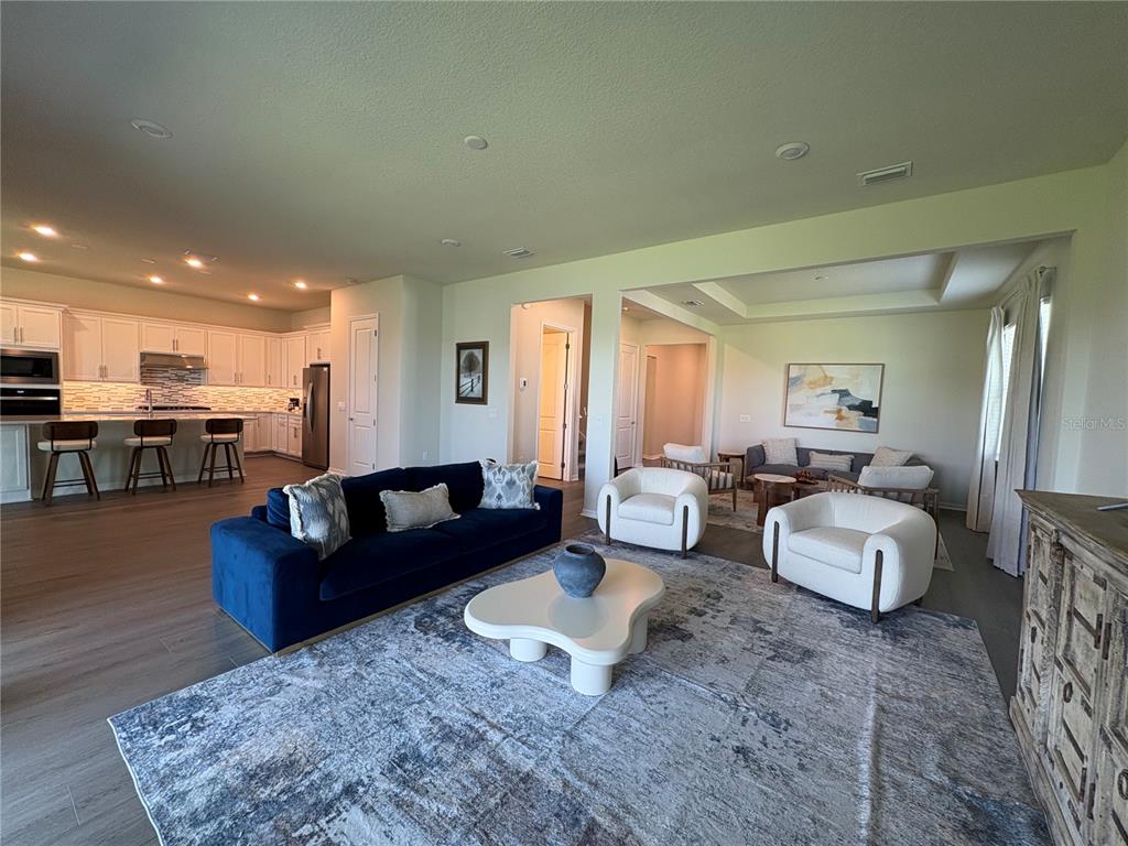 8243 Fenton Street Orlando, FL 32836 - Photo 13 of 35 a living room with furniture couches and kitchen view