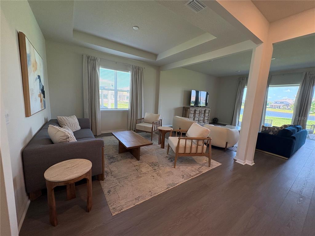 8243 Fenton Street Orlando, FL 32836 - Photo 15 of 35 a living room with furniture and a potted plant