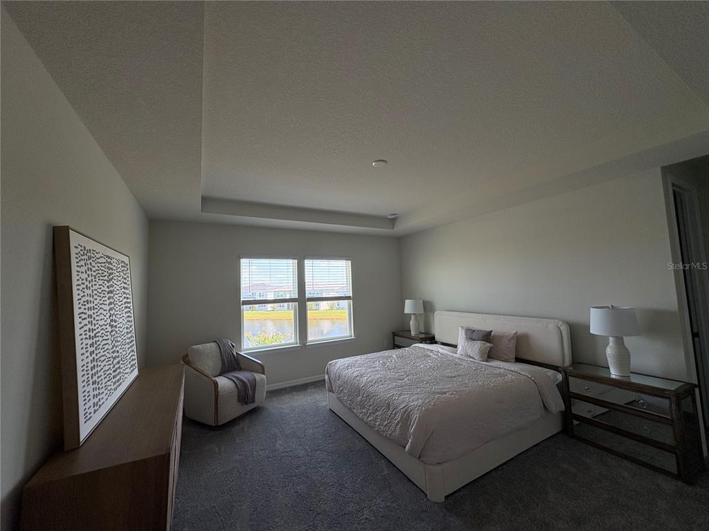 8243 Fenton Street Orlando, FL 32836 - Photo 26 of 35 a bedroom with a bed and a couch