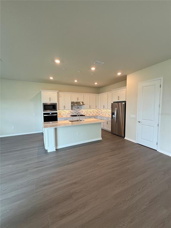 8243 Fenton Street Orlando, FL 32836 - Photo 5 of 35 a view of kitchen with stainless steel appliances kitchen island