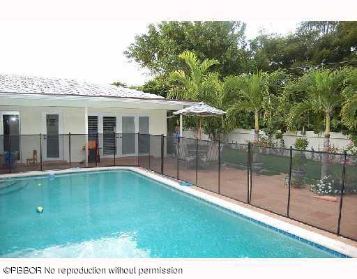 12 Ridge Boulevard Ocean Ridge, FL 33435 - Photo 2 of 13 a view of a house with pool