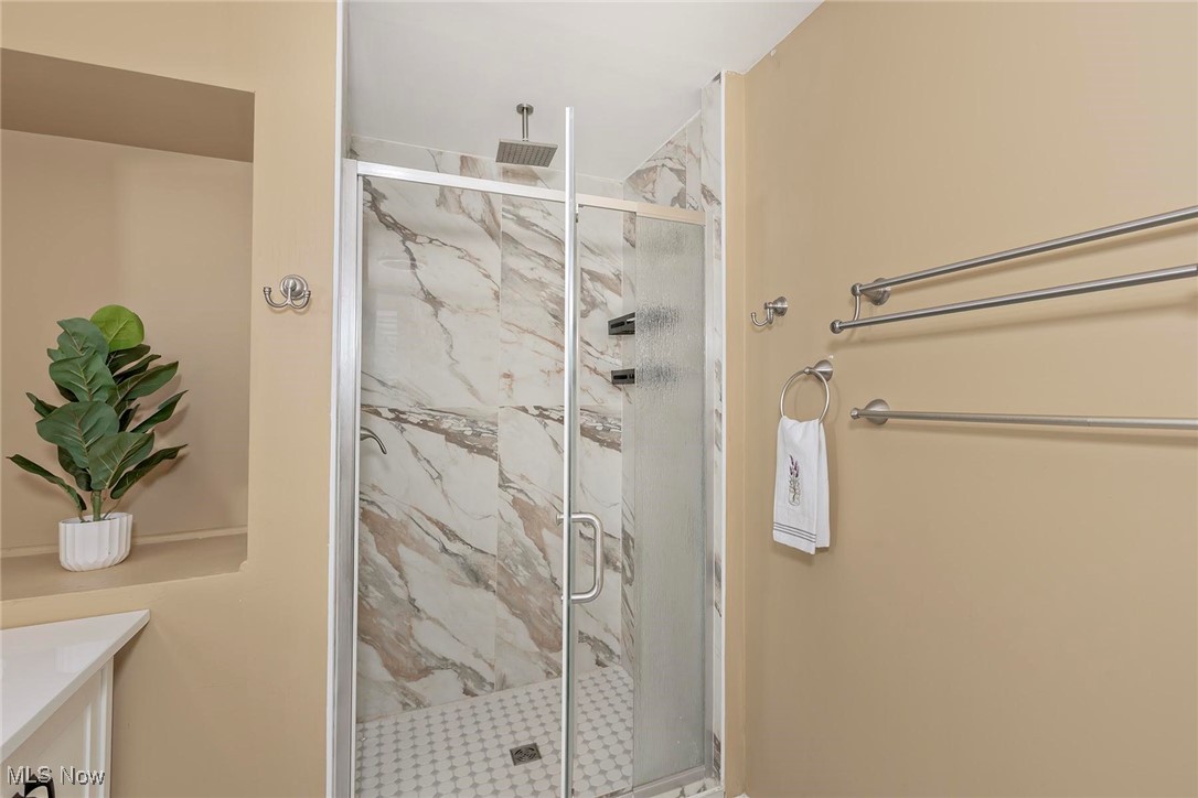 2381 Charney Road Cleveland, OH 44118 - Photo 28 of 47 Bathroom featuring a marble finish shower and vanity