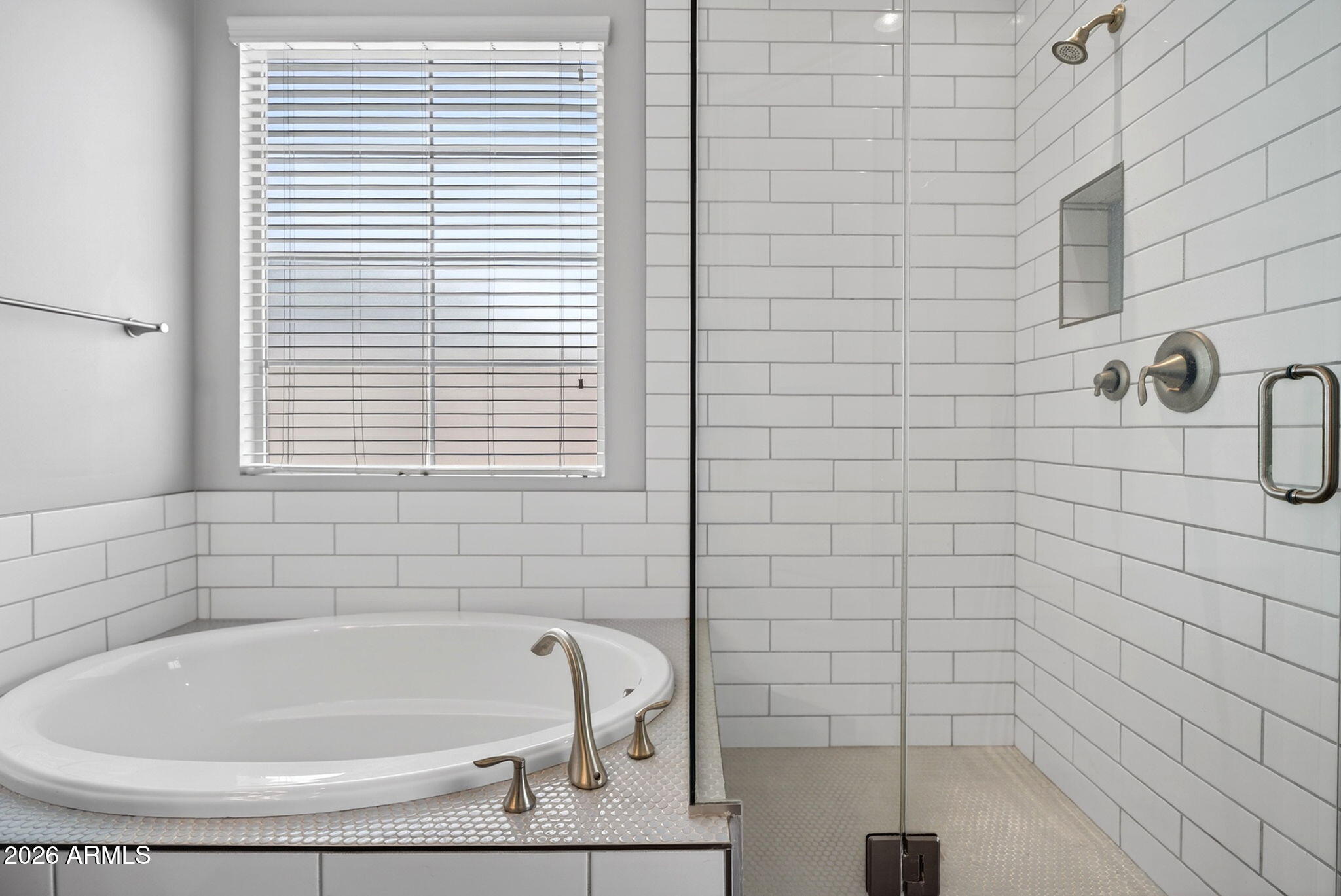 12124 West Peak View Road Peoria, AZ 85383 - Photo 21 of 38 a bathroom with a white tub