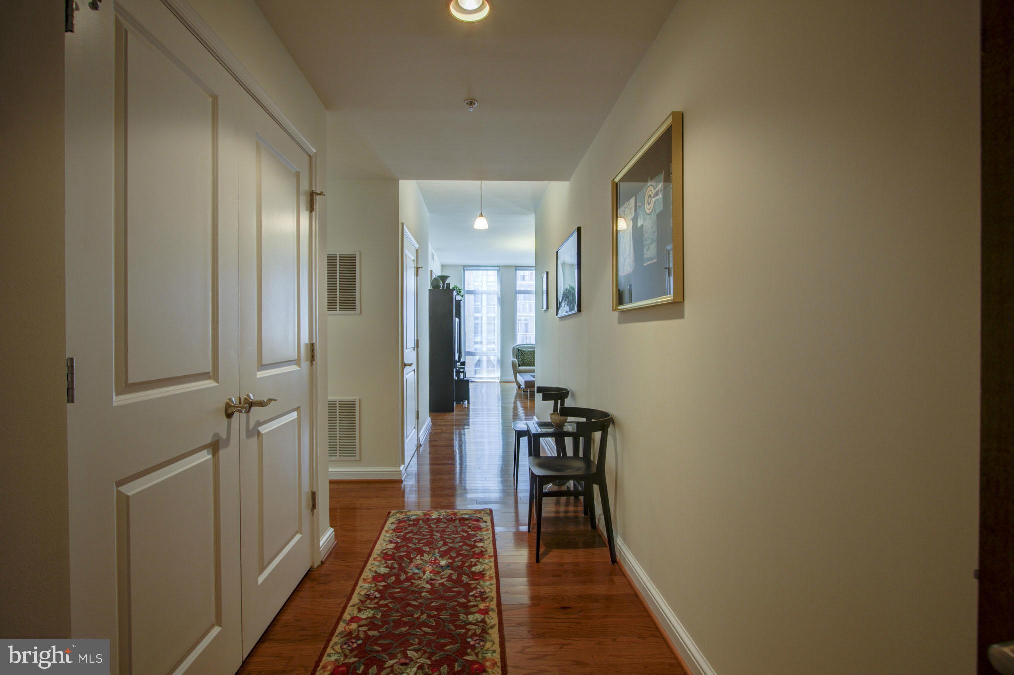 11990 Market Street, Unit 807 Reston, VA 20190 - Photo 3 of 30 Foyer to Living Room