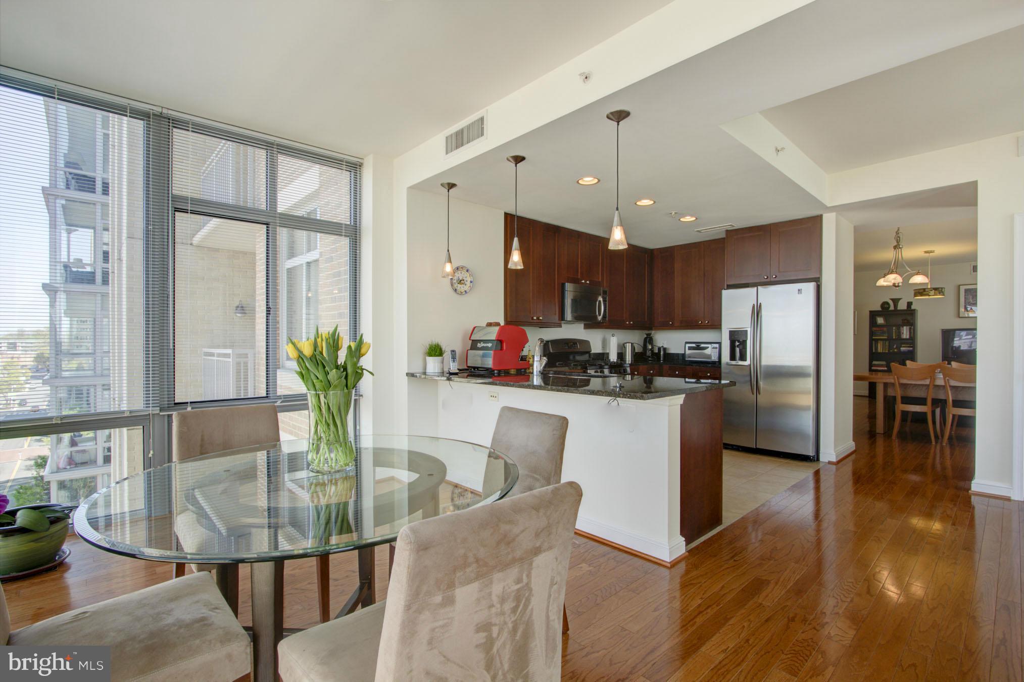11990 Market Street, Unit 807 Reston, VA 20190 - Photo 10 of 30 Family Room to Kitchen