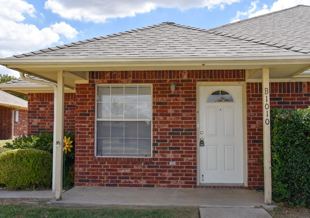 1010 Turkey Creek Court, Unit B Bridgeport, TX 76426 - Photo 1 of 10 front view of a brick house