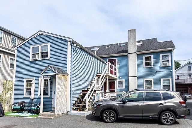 a car parked in front of a house