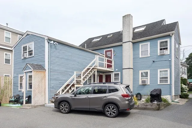 a car parked in front of a house