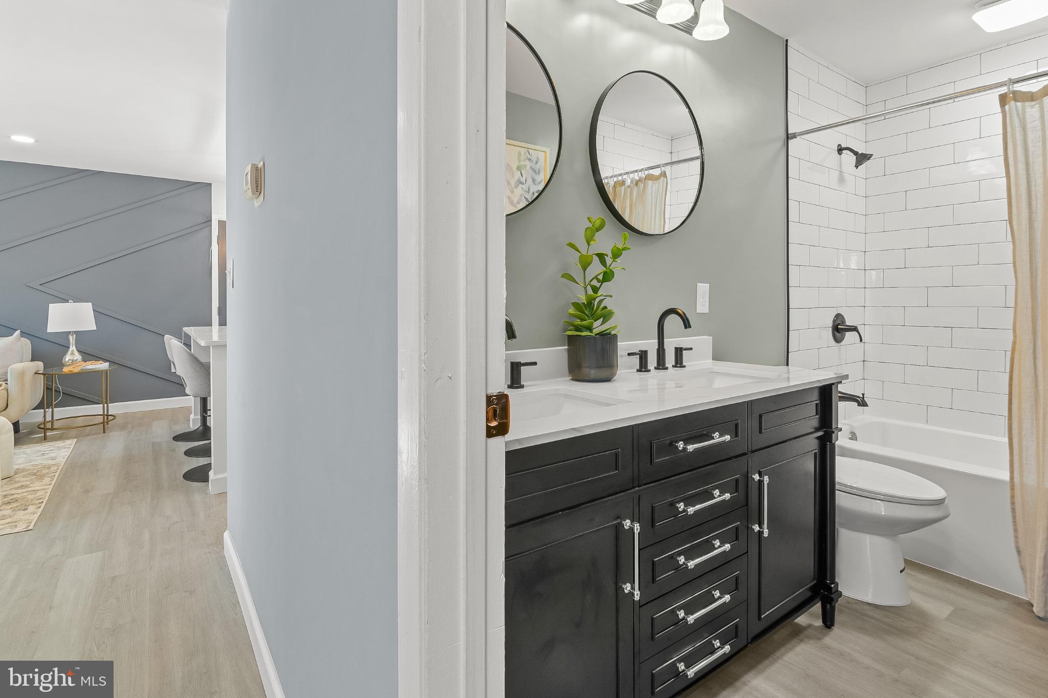 1402 Valley Creek Road Severn, MD 21144 - Photo 25 of 46 Main Bath. 60 Inch Vanity. Ceramic Tile Tub Shower
