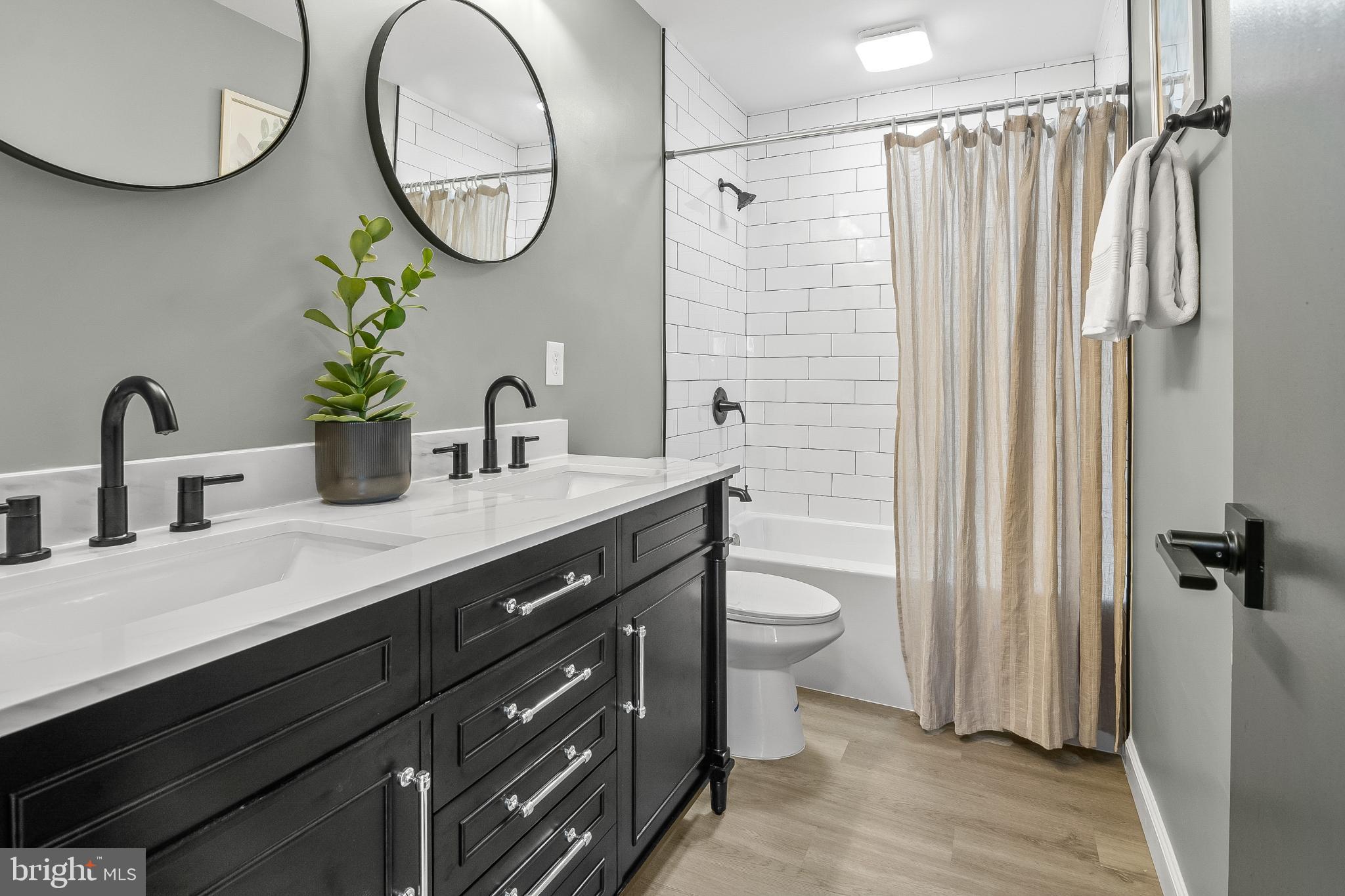 1402 Valley Creek Road Severn, MD 21144 - Photo 26 of 46 All New Bath. New Fixtures, 24 Inch Round Mirrors