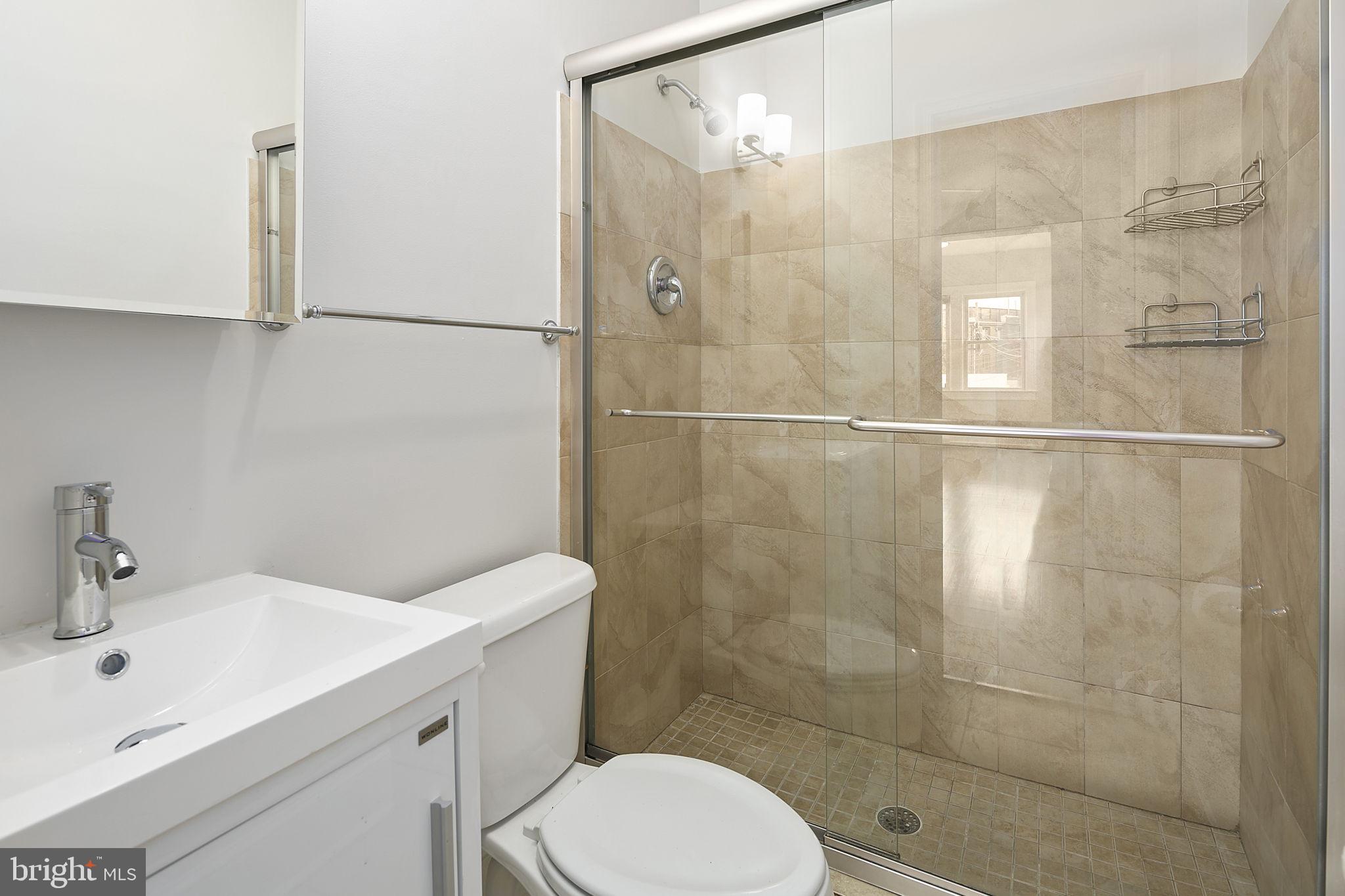 228 17th Street Northeast Washington, DC 20002 - Photo 14 of 31 Primary bedroom en-suite bathroom