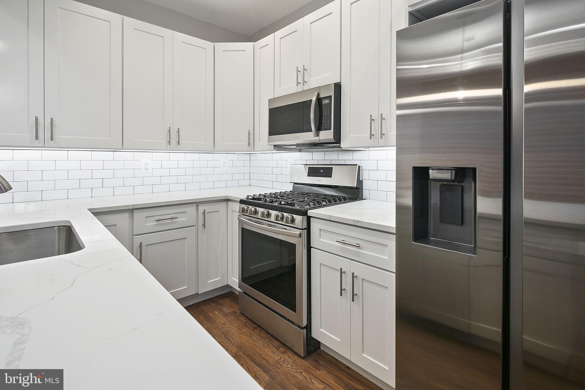 228 17th Street Northeast Washington, DC 20002 - Photo 8 of 31 Bright white kitchen