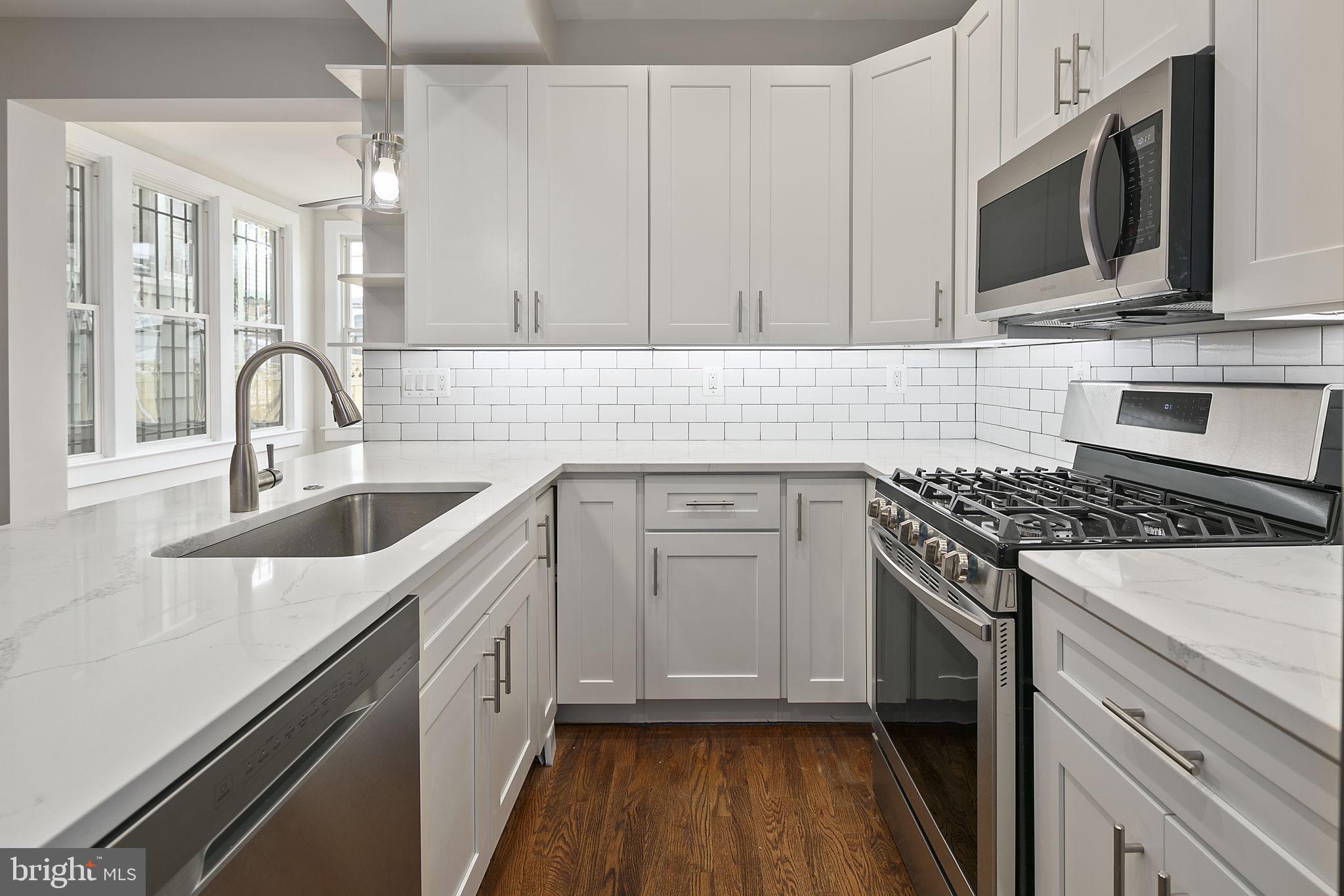 228 17th Street Northeast Washington, DC 20002 - Photo 9 of 31 Bright white kitchen