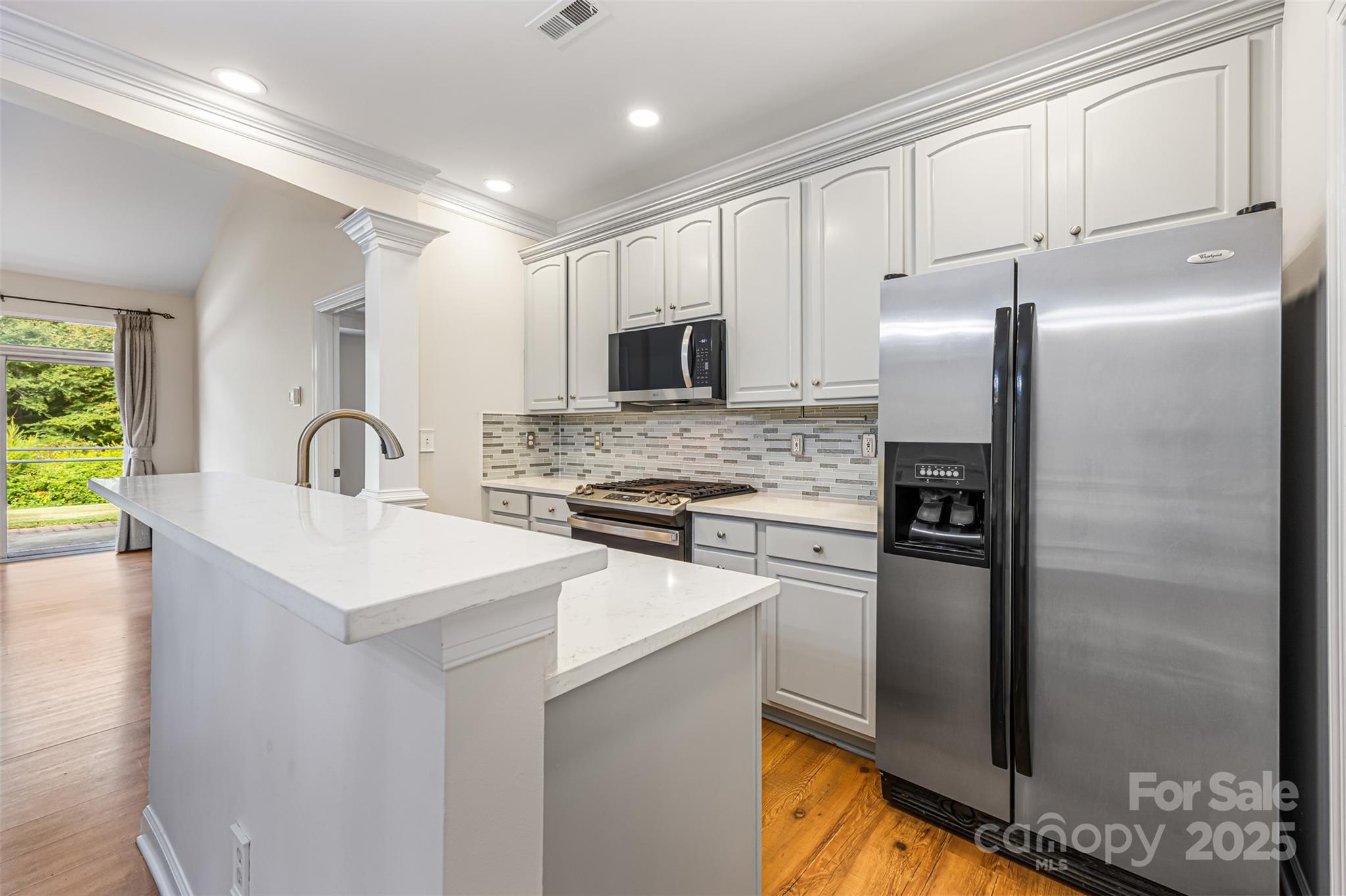 6729 Dusty Saddle Road Charlotte, NC 28277 - Photo 12 of 44 a kitchen with refrigerator and stove