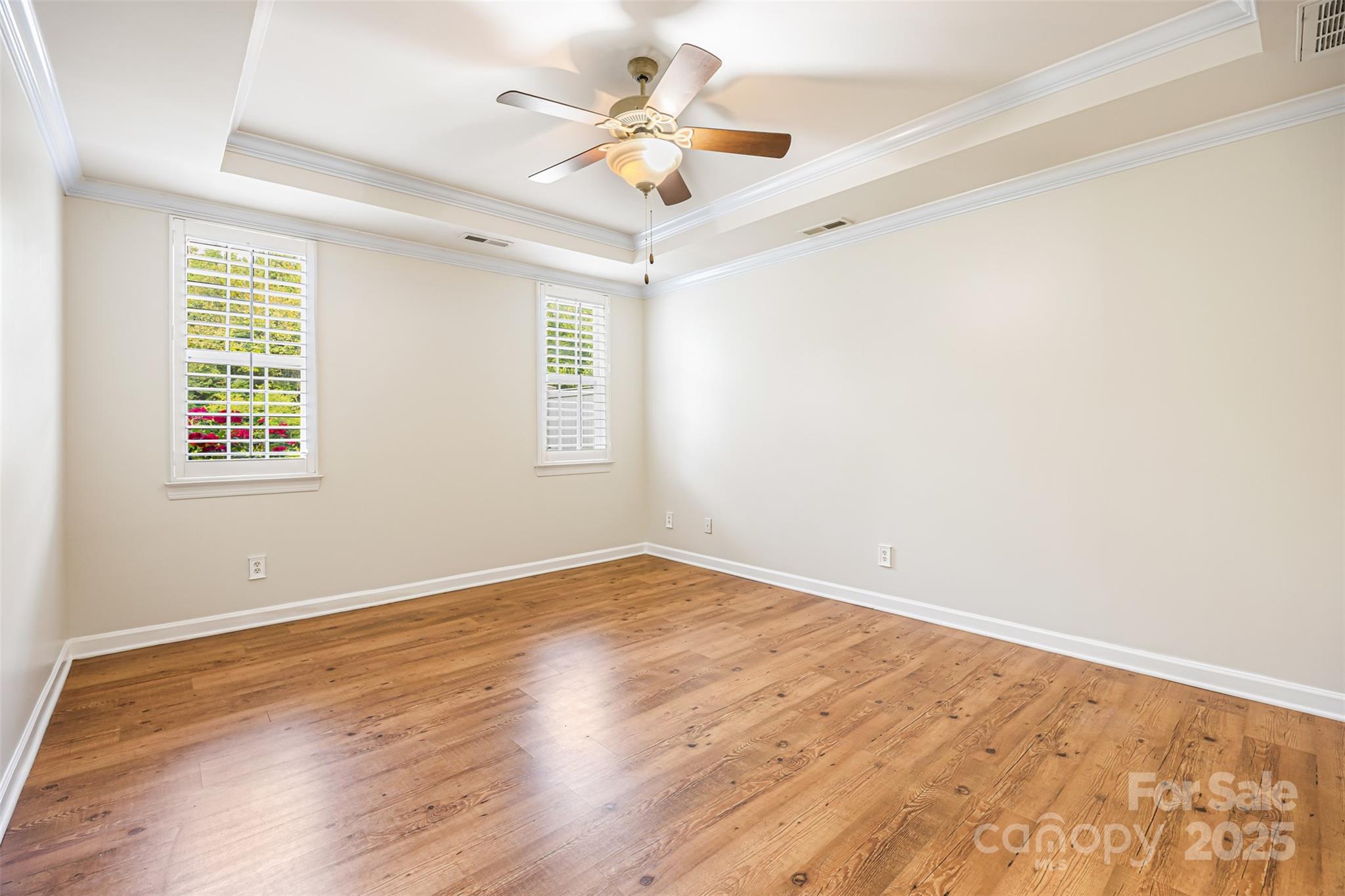 6729 Dusty Saddle Road Charlotte, NC 28277 - Photo 16 of 44 an empty room with a window and a ceiling fan