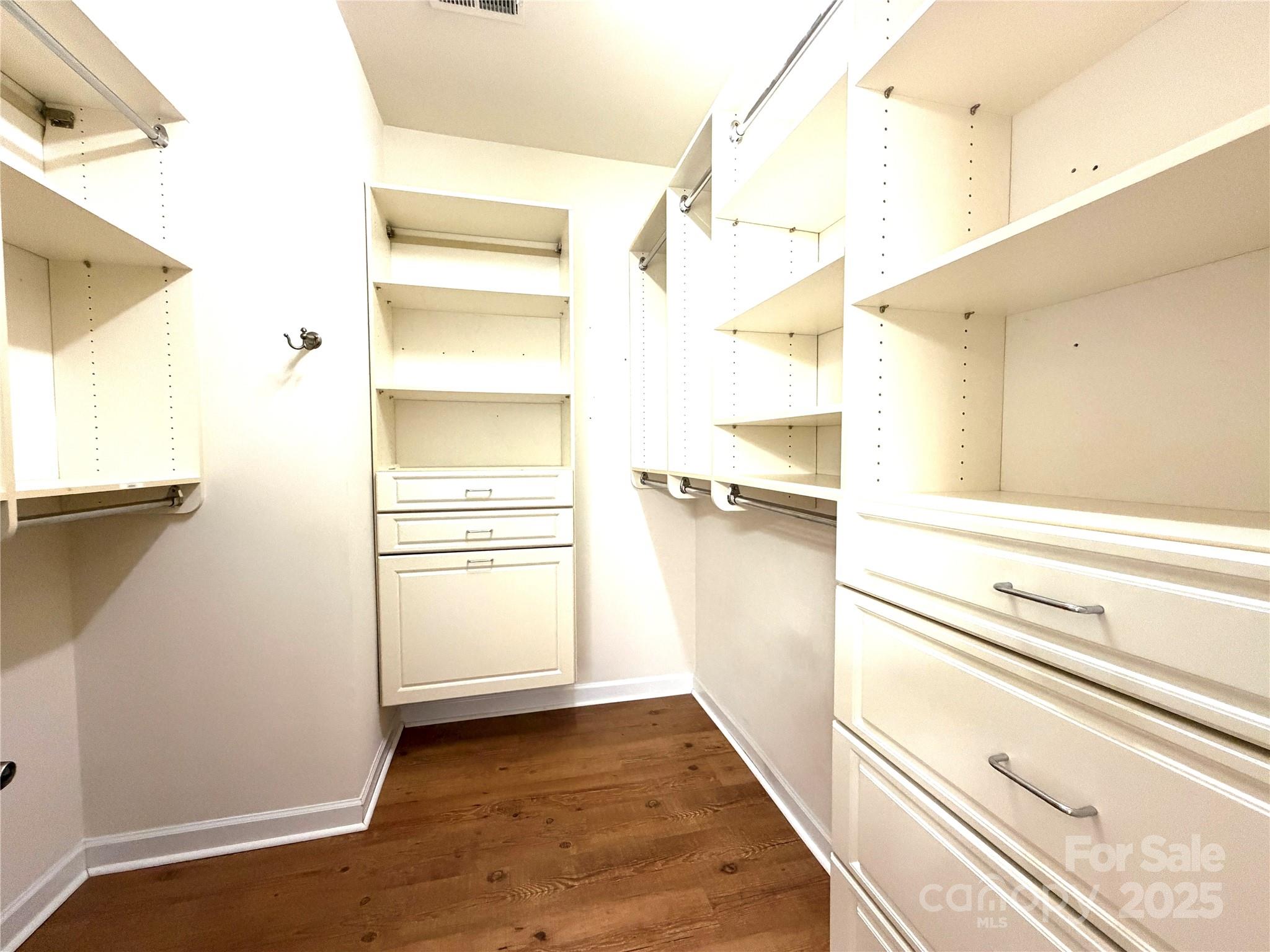 6729 Dusty Saddle Road Charlotte, NC 28277 - Photo 20 of 44 a view of walk in closet with empty racks