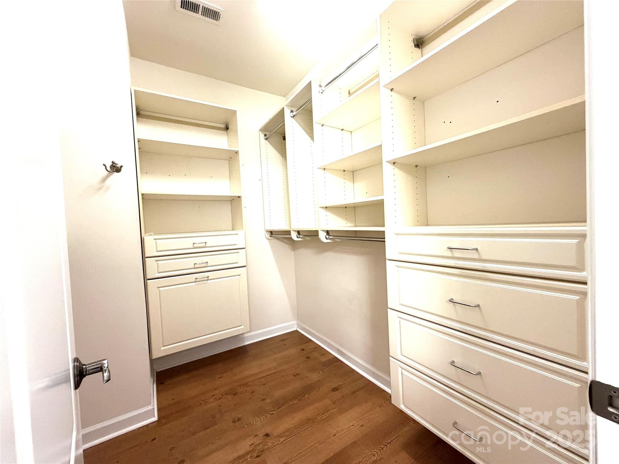 6729 Dusty Saddle Road Charlotte, NC 28277 - Photo 21 of 44 a view of walk in closet with empty racks