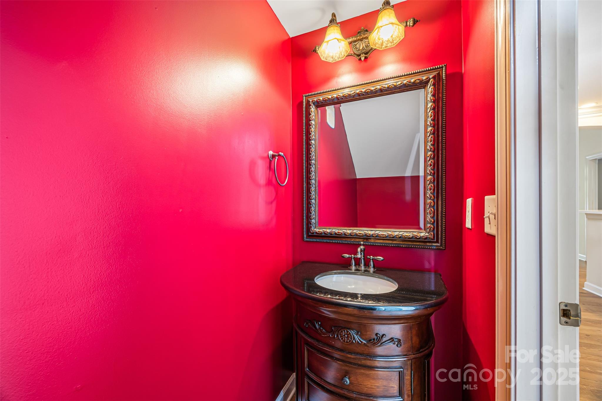 6729 Dusty Saddle Road Charlotte, NC 28277 - Photo 24 of 44 a bathroom with a toilet a sink and mirror