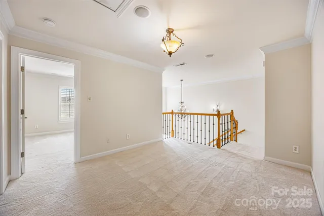 a view of a hallway with a chandelier