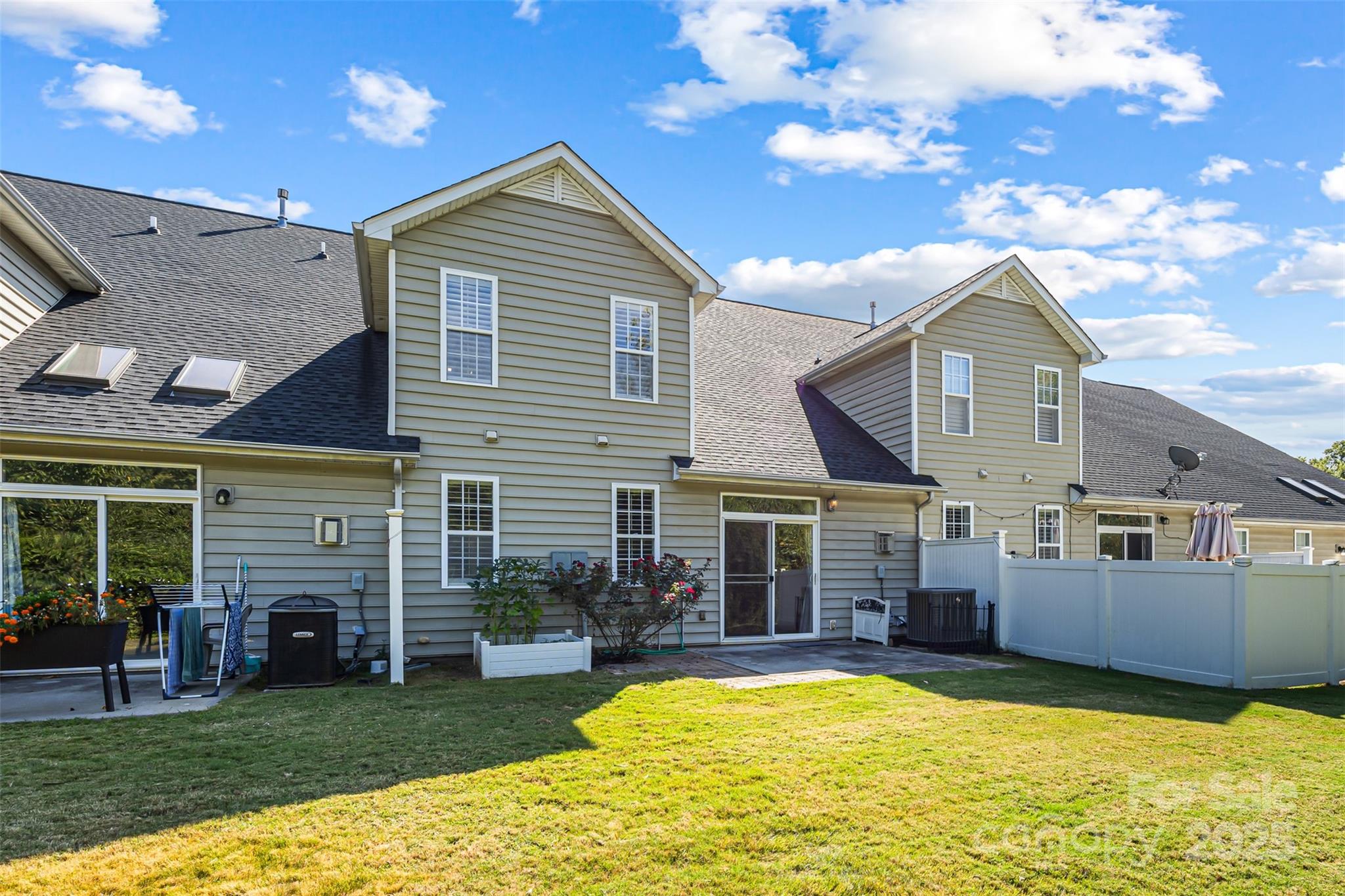 6729 Dusty Saddle Road Charlotte, NC 28277 - Photo 39 of 44 a view of a house with a swimming pool and a yard