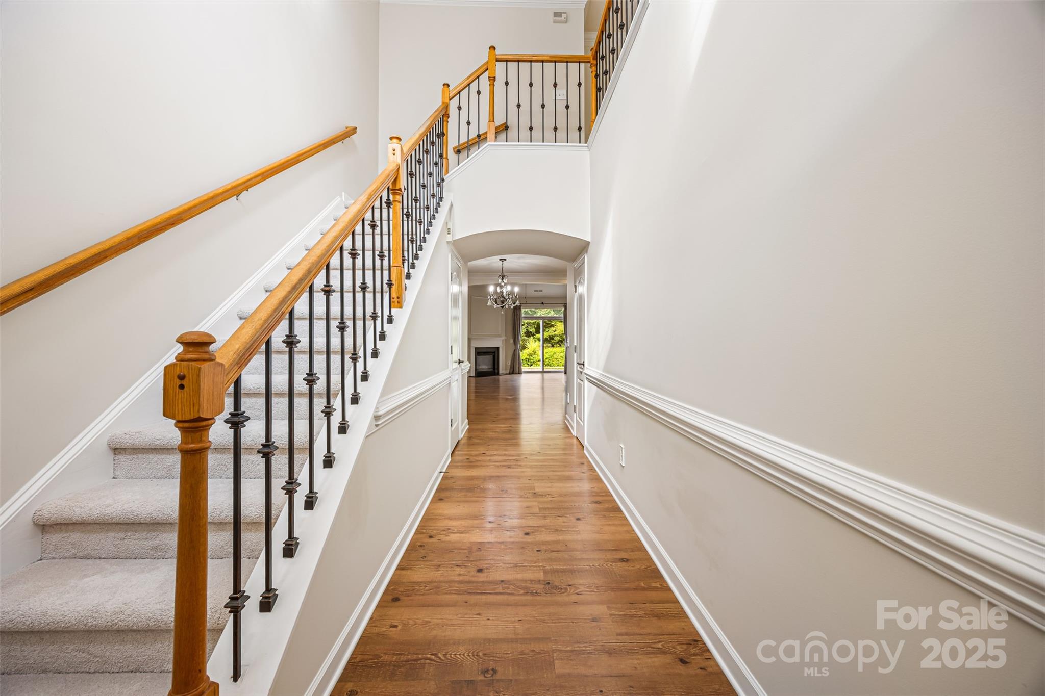 6729 Dusty Saddle Road Charlotte, NC 28277 - Photo 5 of 44 a view of a hallway with wooden floor
