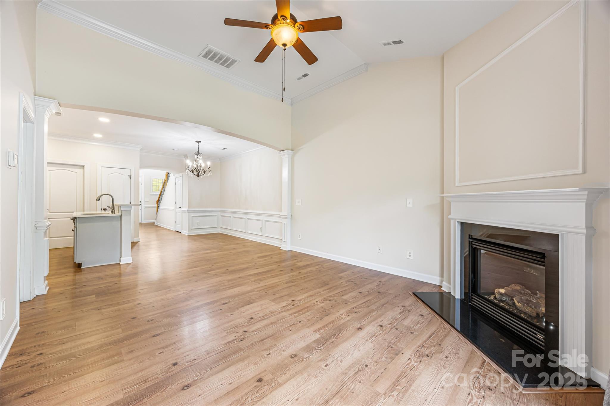 6729 Dusty Saddle Road Charlotte, NC 28277 - Photo 6 of 44 a view of empty room with wooden floor and fireplace